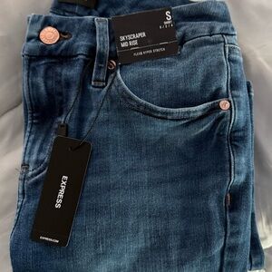Express Mid Rise (Darker) Medium Wash FlexX Skyscraper Jeans